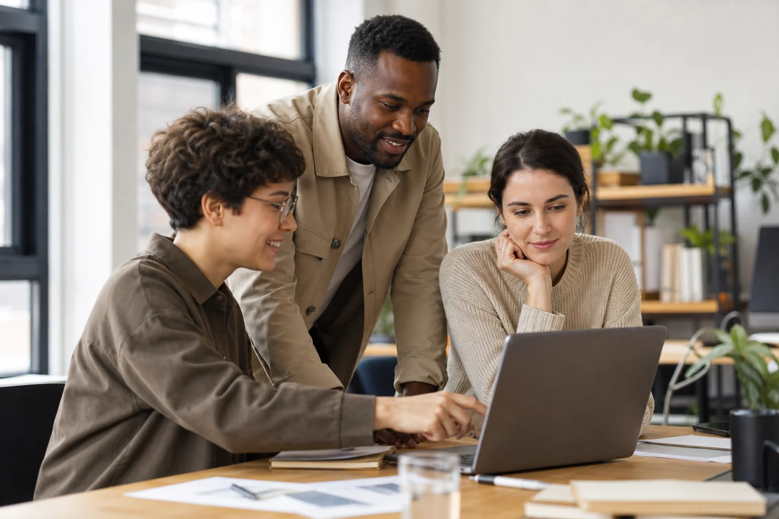 Globally diverse and approachable small-business technology team collaborating