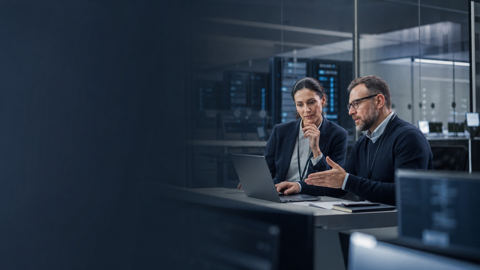 IT operations manager and business leader reviewing data protection and recovery planning